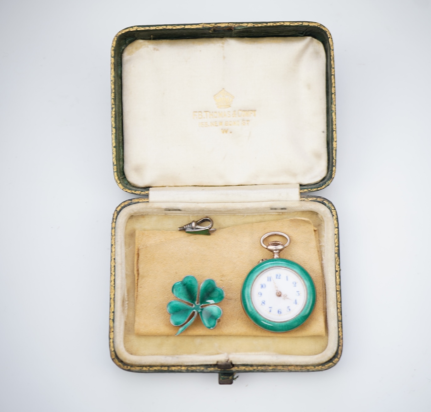 An enamel pocket watch and brooch, early 20th century